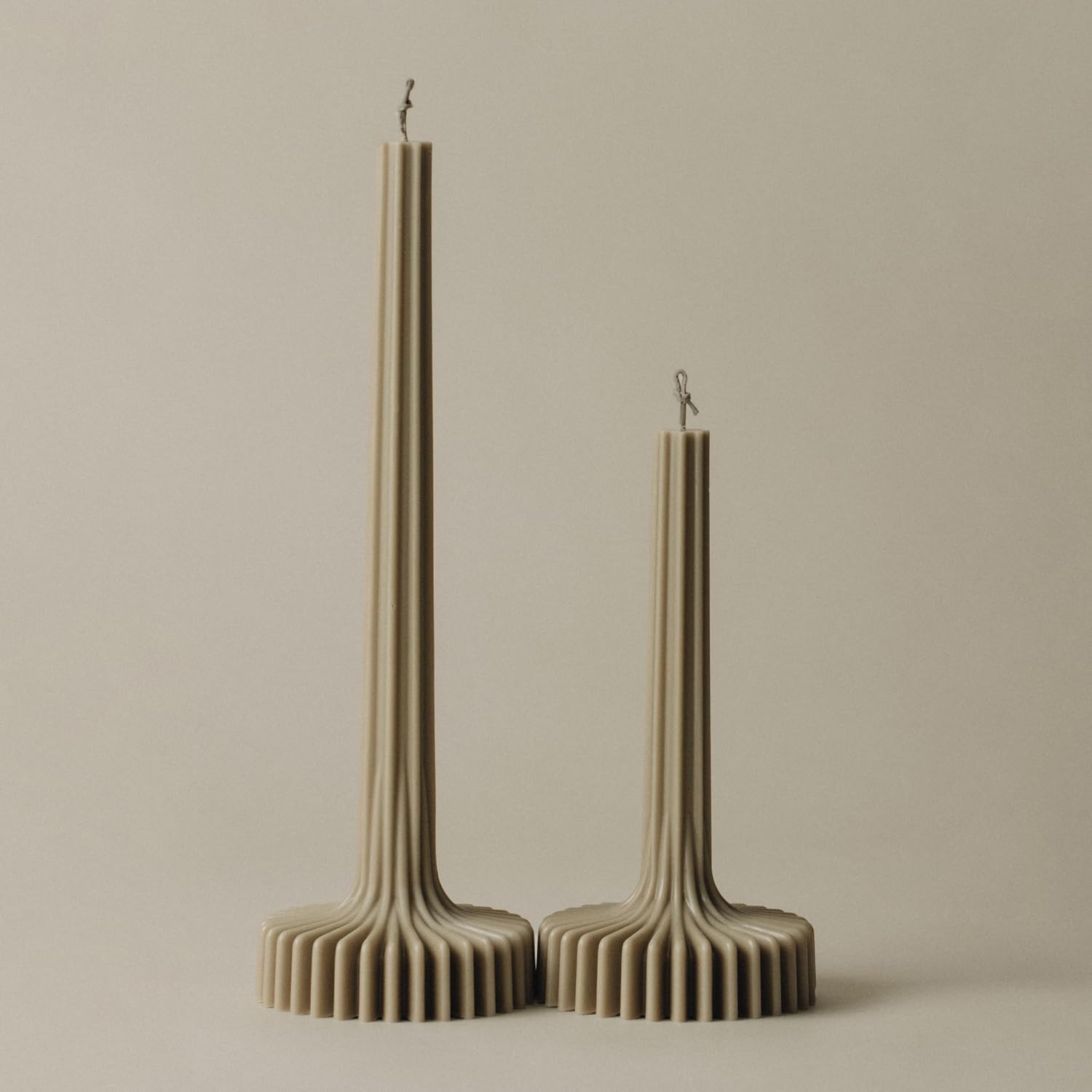 Actual LAWA Olive Beige Vase Candle pair, with tall fluted stems and broad ribbed bases, in two heights.